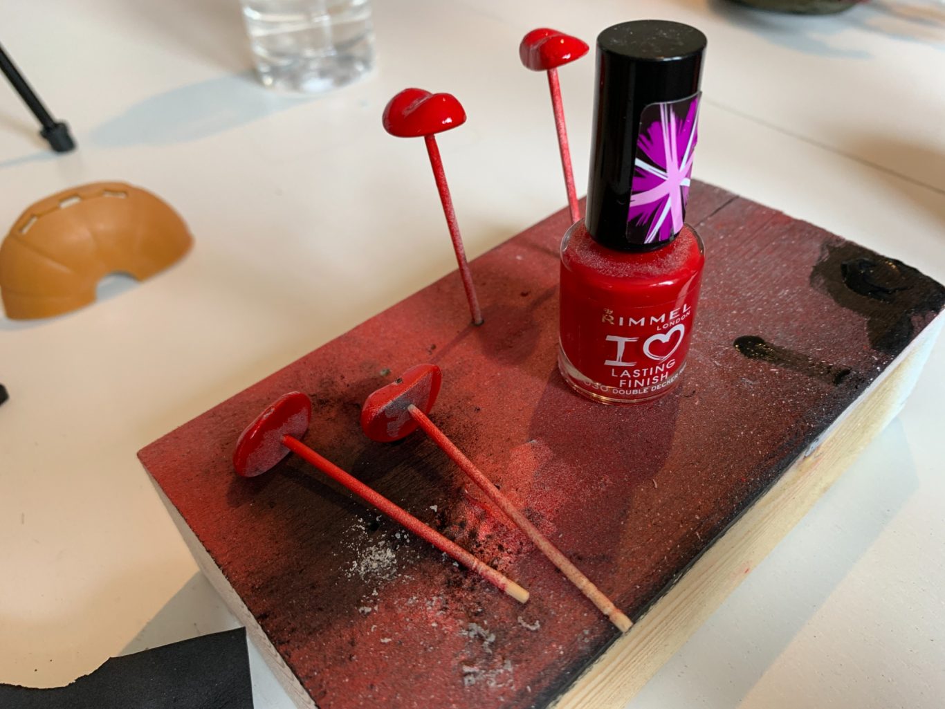 Tongues getting a coat of nail polish to give them a wet look